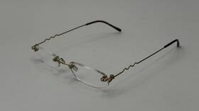 Dp-19064 Foster Grant Design Optics Fg Rimless Readers #1.75 Faux Tortoise Shell Squiggly Wire Temples