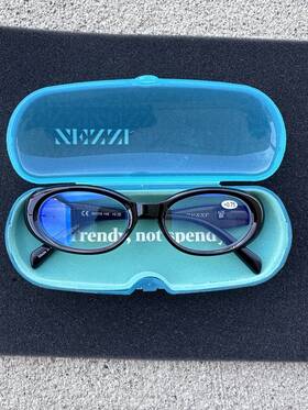 R0067221075 Zenni 0.75 Blue Light Reading Glasses Black Oval Plastic Frame 54-19-145