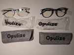 Opulize Blue Light Blocking Glasses 2 Pack Clear & Black Frames W/ Cases. Fixed Price $9.47.