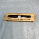 Design Line Bamboo Sunreader Reading Glasses +2.50 Rimless Gray W/ Case 7756. Fixed Price $7.20.